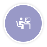 Person at desk looking at computer screen icon